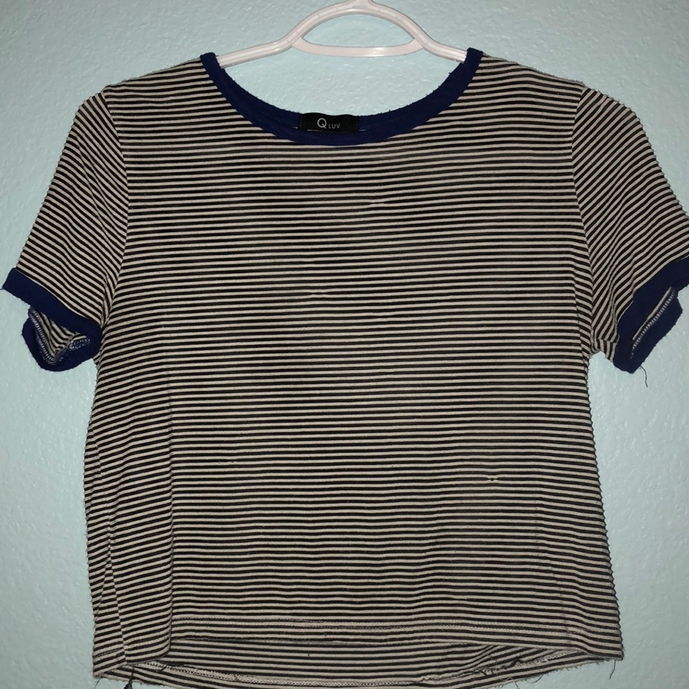 Black and white stripe crop top with blue sleeves.